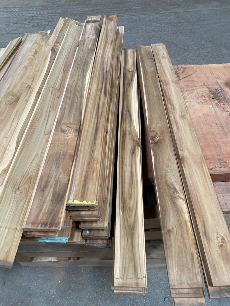 Kiln-dried teak boards stacked